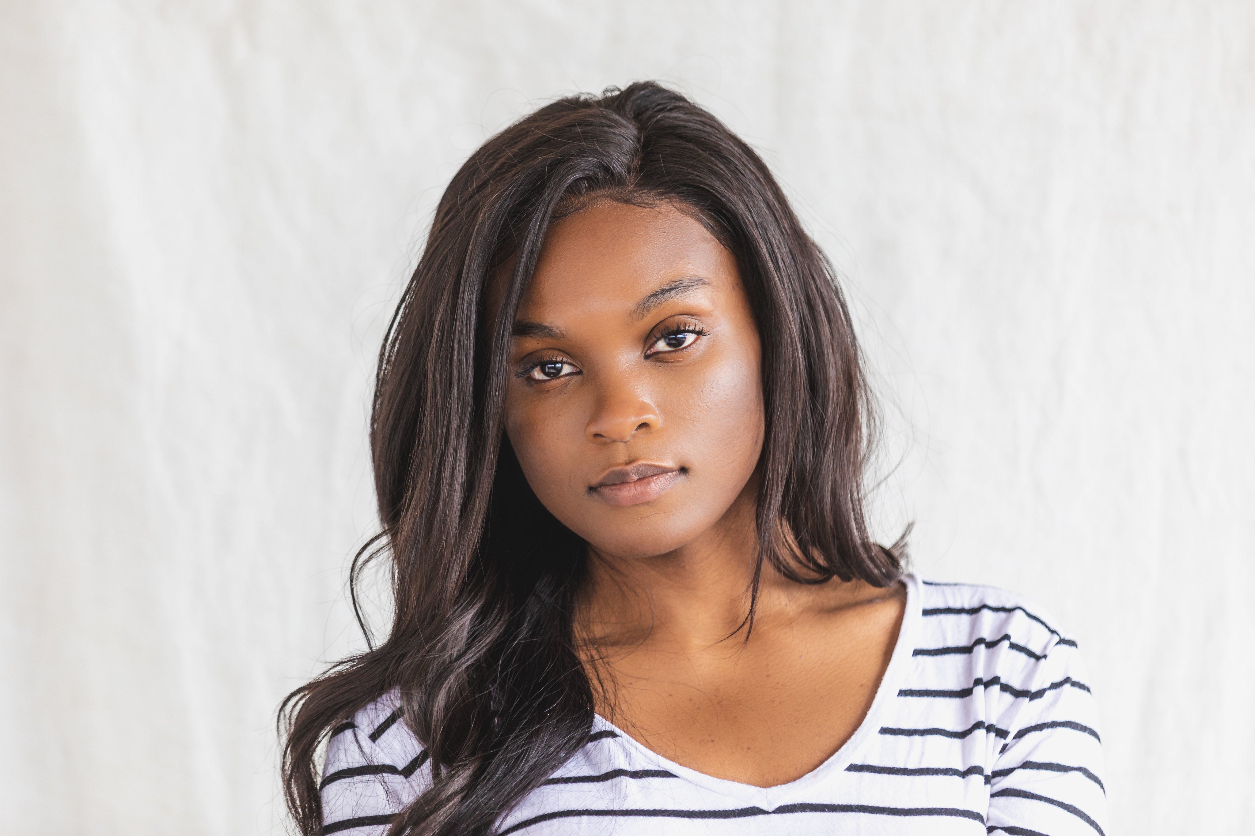 files/a-young-woman-posing-in-a-black-and-white-shirt.jpg